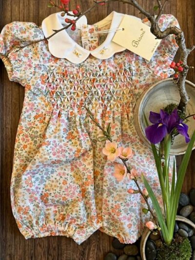 Pagliaccetto punto smock fiori arancioni Bisou