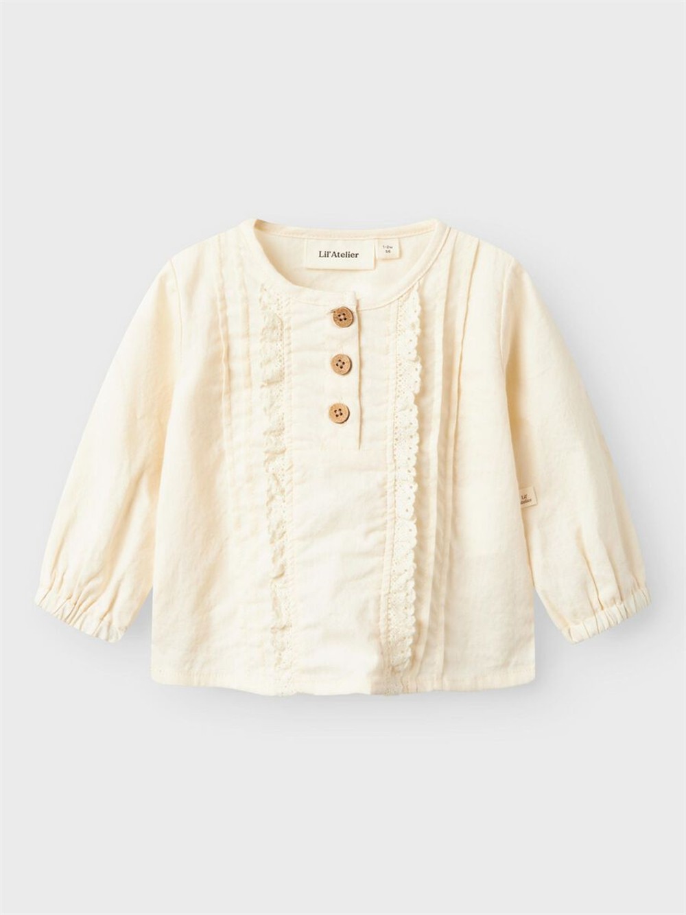 Camicia in cotone avorio con rouches e bottocnini in legno Lil Atelier